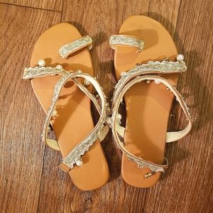Embellished big toe hugging dangly beach sandals